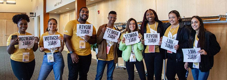 Early Connections leaders pose with their dorm signs